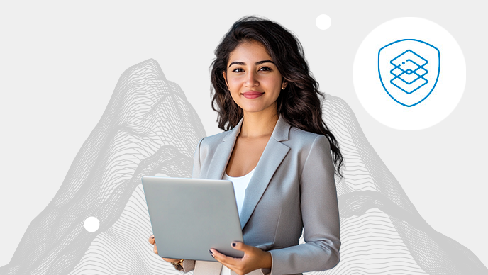 A young woman with a white top typing on a black laptop with an inset icon of stacked sqaures