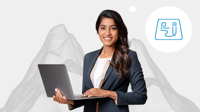 A woman with a green collared shirt holding a black laptop with an inset icon in a white circle