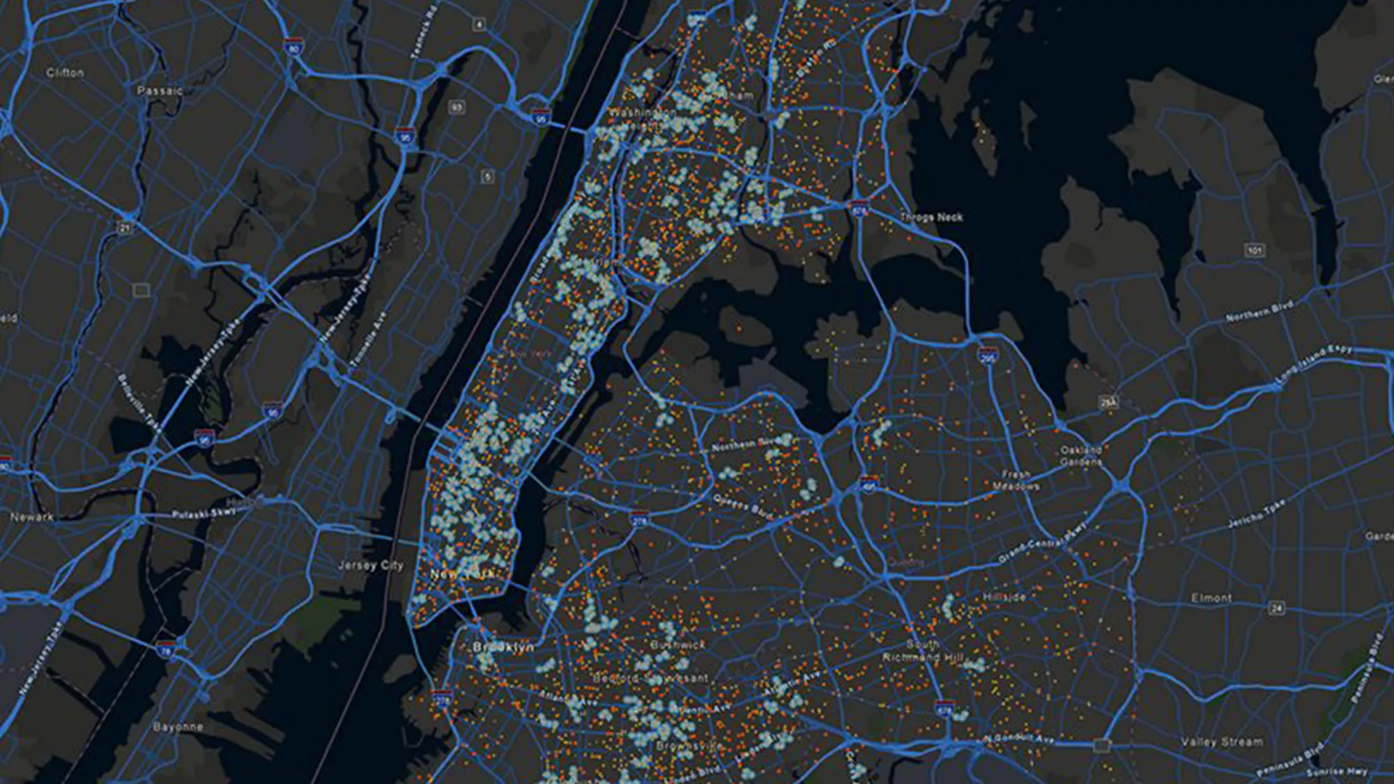 A map with blue lines indicating roads and highways. Numerous small, colored dots are clustered throughout the map, representing data points.