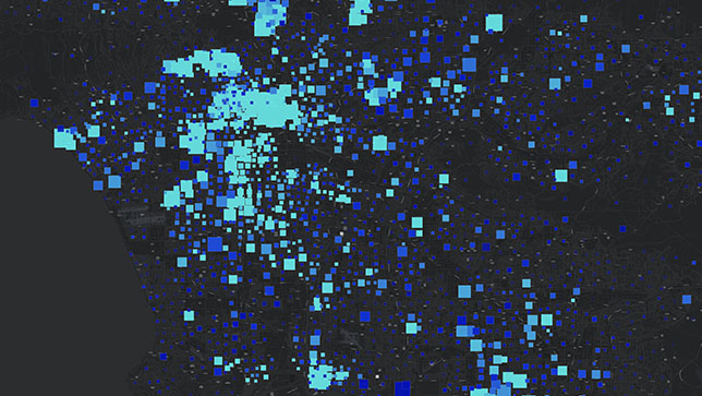 A map area illuminated with blue squares of varying sizes and shades of blue representing data