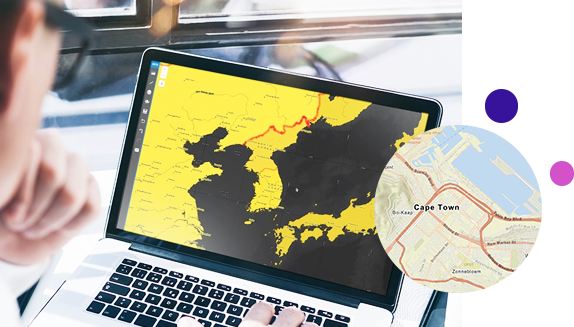 Laptop showing a map with land in yellow and water in black