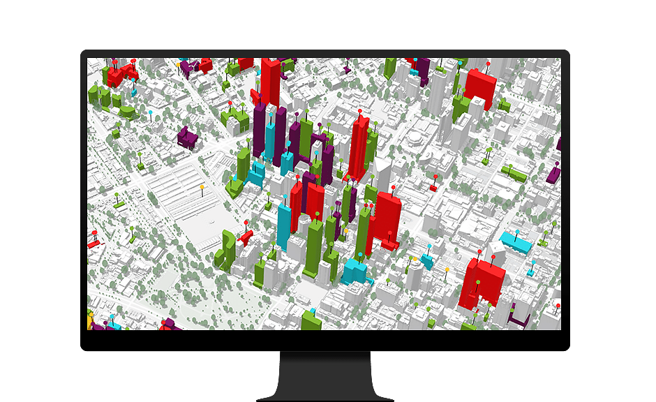 Computer monitor showing 3D visualization of buildings in a city