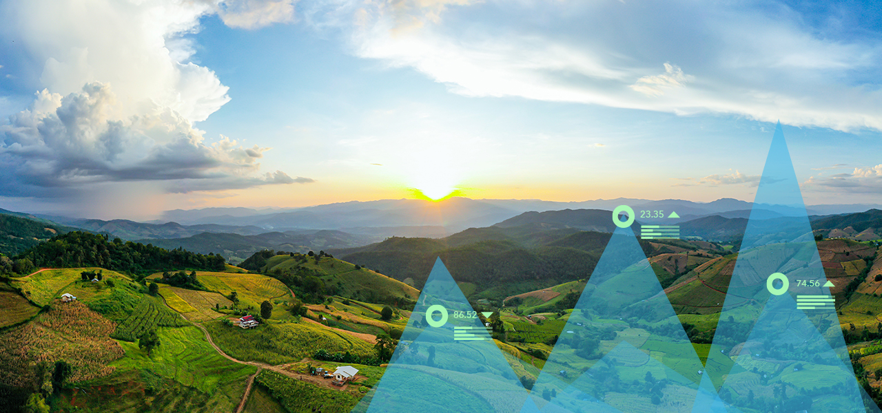 Landscape of green mountains with two triangle graphics on top