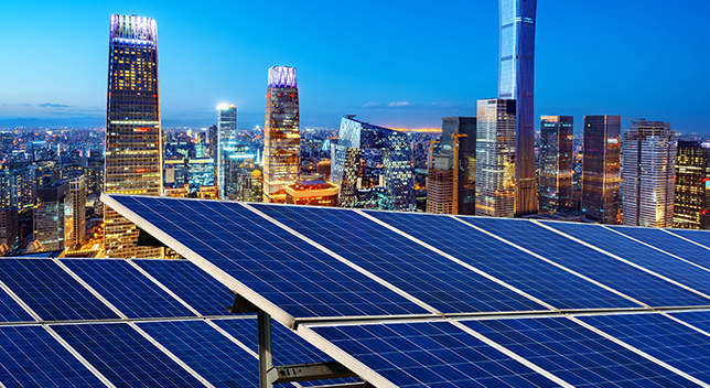 Solar panels in the foreground of a cityscape