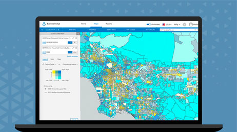 A graphic of a laptop screen displaying a country map with multicolored points on a blue background alongside a map legend