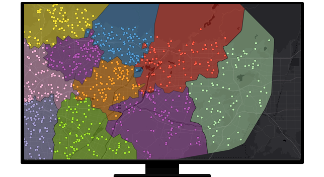 A graphic of a computer monitor displaying a map with areas shaded in many colors