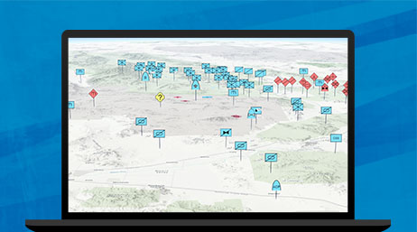 A graphic of a laptop monitor displaying a 3D area map with features labeled in blue and red