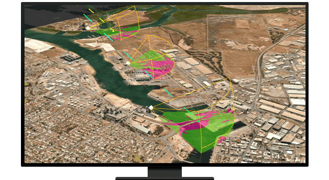 A graphic of a computer monitor displaying an aerial photo of a desert city with segments shaded in green and pink
