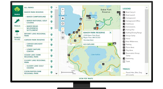 A desktop computer showing a website where users can select parks, trails, and things to do, and a map view with information about the parks in the selected area