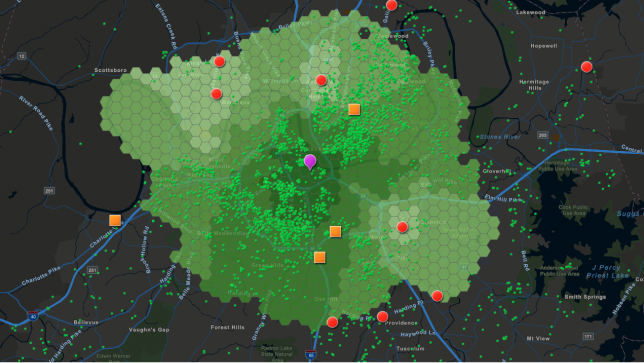 Dark gray map with large green area and multi-colored dots