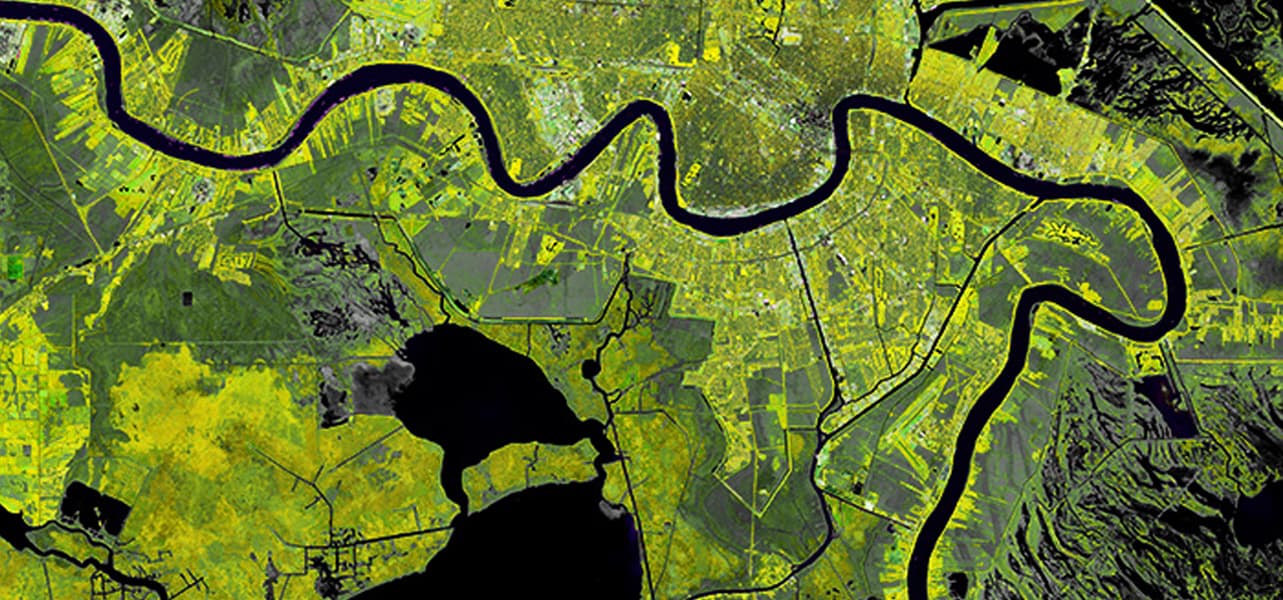 Satellite image of a city with a river running through it.